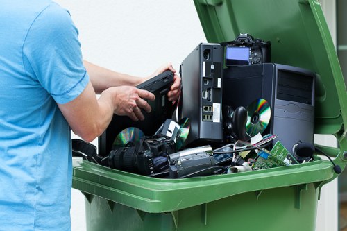 Recycling bins filled with various recyclable materials